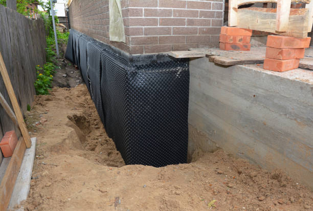Happy homeowners after waterproofing job in Pennington